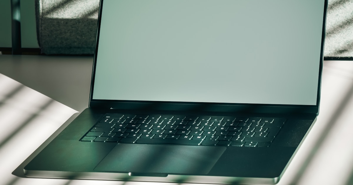 Open laptop with a blank screen on a desk